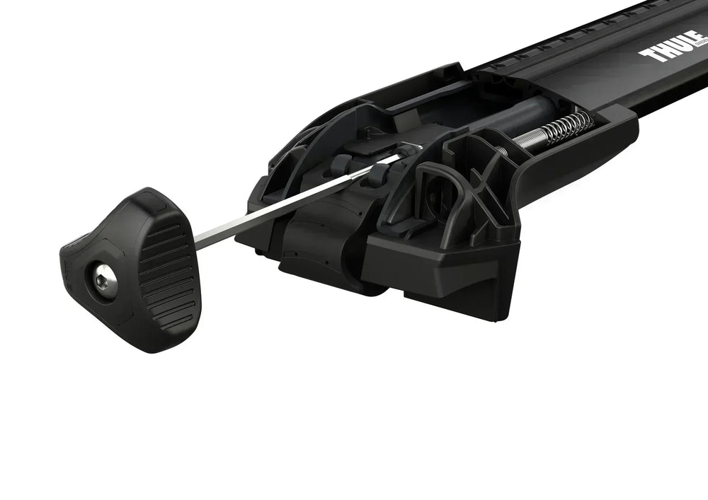 Close-up of a black car roof rack with 'Thule' branding on a white background