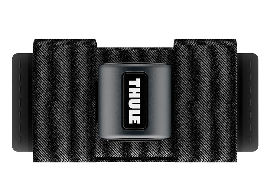 A black Thule SkiClick ski carrier with the Thule logo visible on the strap, designed for transporting cross-country skis.