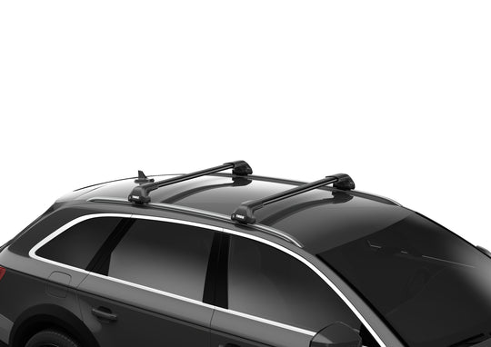 Car roof rack system on a black car with a white background
