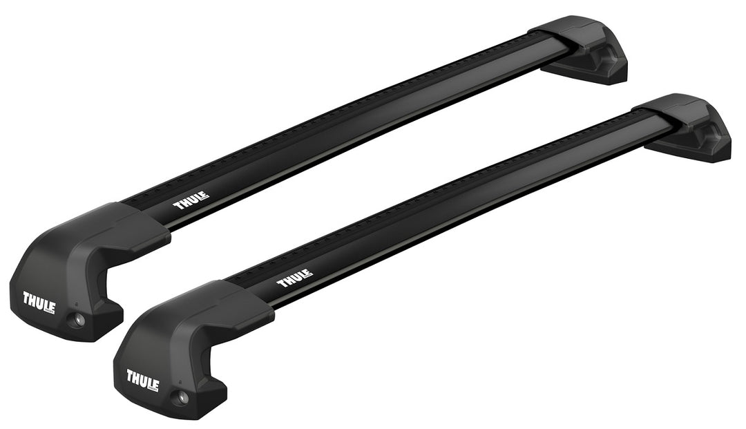 Two black Thule roof racks on a white background