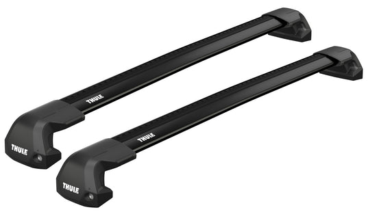 Two black Thule roof racks on a white background