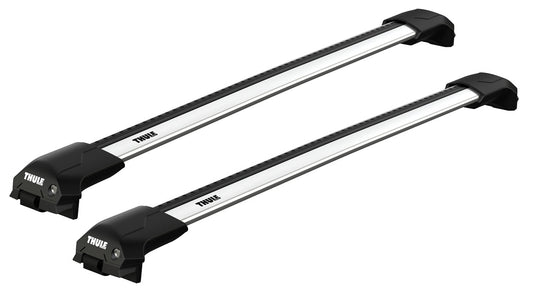 Two Thule roof racks on a white background