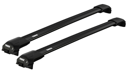 Two black Thule roof racks on a white background