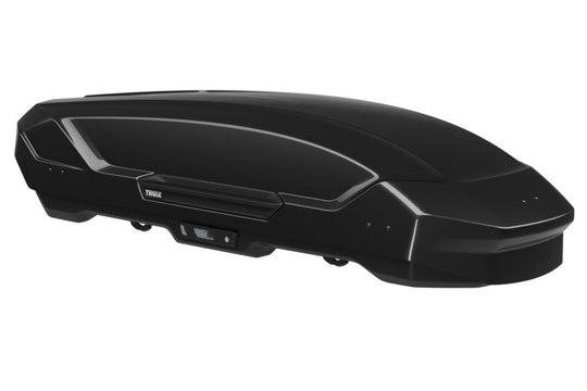 A black Thule Motion 3 cargo box for vehicle roof storage.
