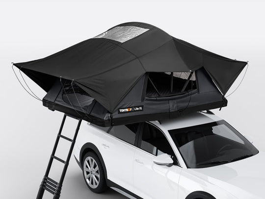 TentBox Lite XL 4 person roof tent mounted on car in the UK, set up for camping